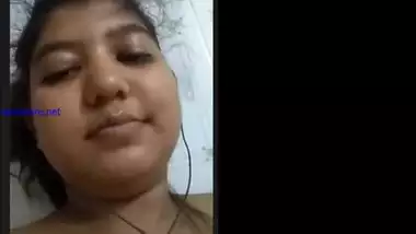 Cheeky Indian girl sticks her tongue out besides showing tits