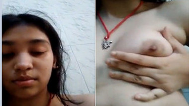 Indian teen turns on touching tits and shoves fingers into pussy