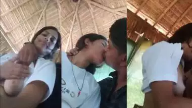A guy presses a girl’s boobs outdoors in the local sex video