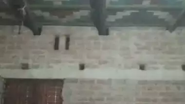 Village girl applying lotion to full nude body