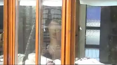 NRI house wife cleaning glass and showing naked figure