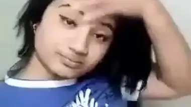 Beautiful desi girl lifting top to reveal sexy boobs
