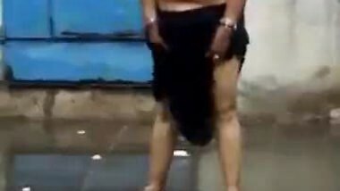 Topless matured aunty enjoying rain