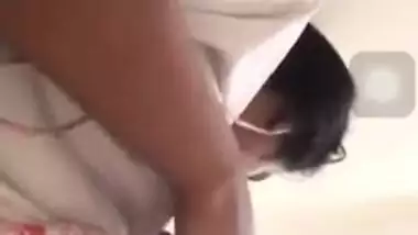 Girl performs XXX show and pulls up white T-shirt to expose boobs