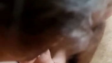 Smiling girl Indian blowjob to her customer