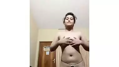 Likable Indian girl takes off a dress to demonstrate hairy vagina