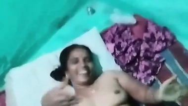 Village sex of a wife putting a condom on dick before sex