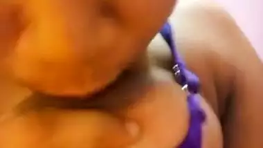 Wife in a blue sex bra takes a XXX Indian tit out and squeezes it