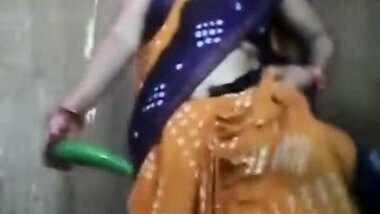 Innocent looking aunty playing with cucumber