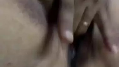 Priya fingering her trimmed cunt