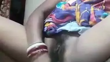 Real horny Desi wife dildoing her both holes