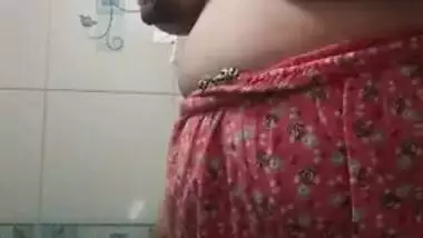 Mature Desi undresses to reveal XXX tits before taking a shower