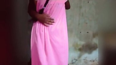 The milf, dressed in a nightgown, performs a...