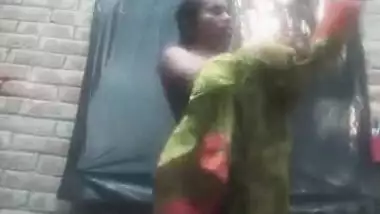 Bengali village girl bathing outdoors clip