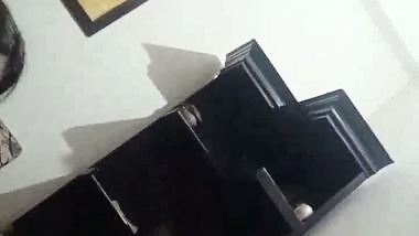 The lady gives a desi blowjob to the man on the couch