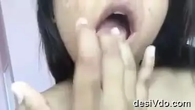 cute gal revathy fondling her pussy & licking her cum