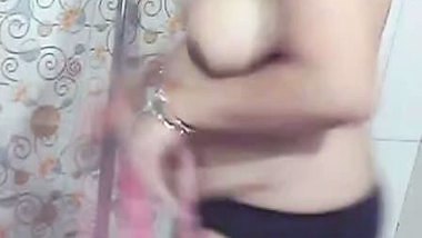 Beautiful MILF stripping in bathroom before nude bath