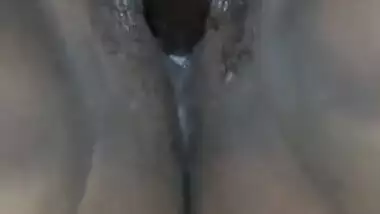 Indian Bhabhi Arpita fingering her hairy pussy with Brinjal
