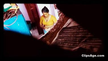 Desi maid changing dress captured using placed in room