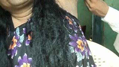 barber shaving with shaving cream.