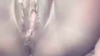 Showing her wet pussy
