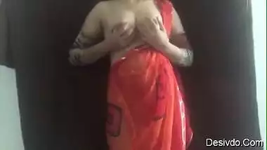 hot sexy desi wife simran bhabhi showing boobs and ass in red saree