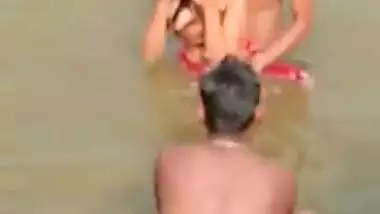 Desi girl enjoying river bath with group of boys