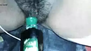 Indian horny slut using a plastic bottle as her sex toy