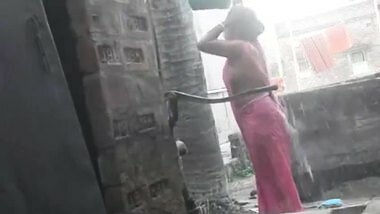 Voyeur - Indian BBW bathes outside