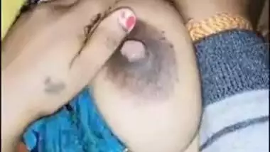 Squeezing boobs of sleeping wife