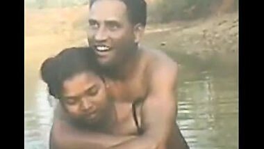 Village couple outdoor bath in pond