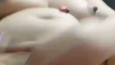 Chubby, young lady enjoys fingering her shaved pussy