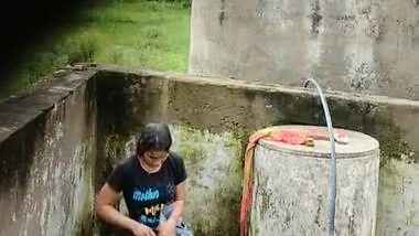 Indian Village Girl Bathing Near Water Tank Outdoor
