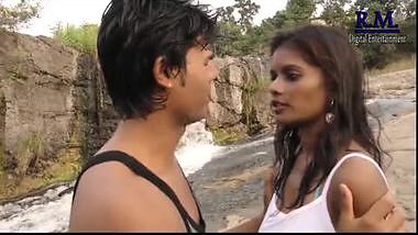 Outdoor romance under waterfall in bollywood