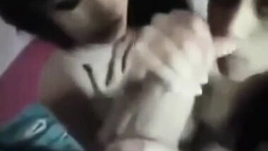 2 Indian girls sucking a big cock