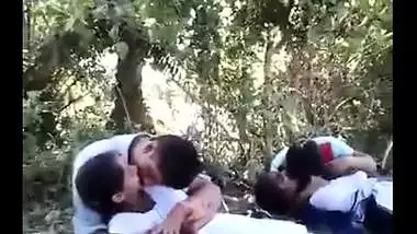 College couples enjoying outdoor kissing infront of their allies
