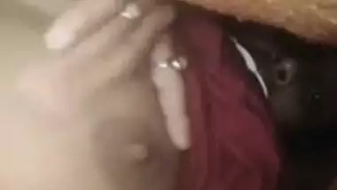 Lecherous Desi gal demonstrating her tits online under the blanket