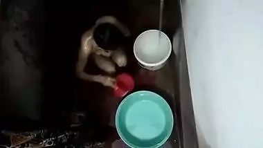 Hidden footage of naked XXX Desi housewife relaxing in the bathroom