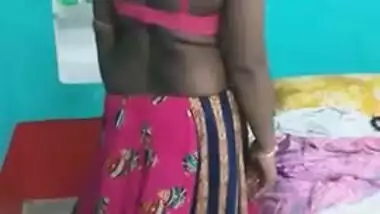 Hot like hell Desi female in sexy pink dress poses for the camera