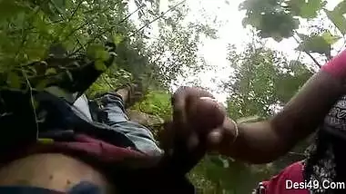 Guy simply lies on back but sex partner gives him a blowjob outdoors