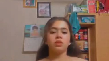 A girl strips to record her MMS in Bangla sex