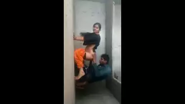 It looks like an amateur Indian couple is having sex on the wall