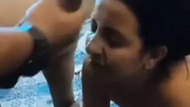 A girl gets cum on her face in an Indian threesome blue film
