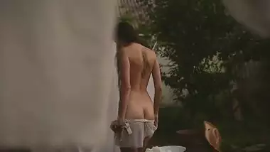 Beautiful girl getting naked for a hot fuck in the garden