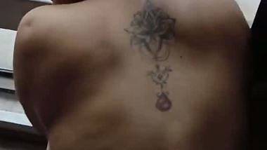 Lady fucks in front of a transparent glass in Indian porn