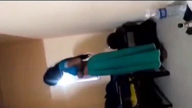 A desi aunty strips to seduce her lover in a Tamil aunty sex video