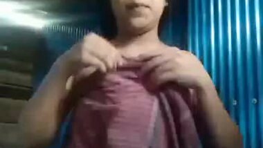 Cute slum girl recording her own dress change
