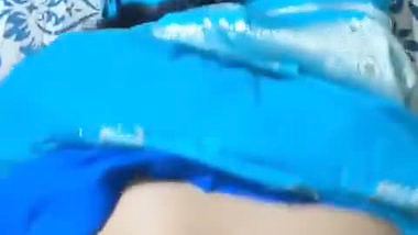 Desi chudai of Bhabhi lying on bed in blue saree