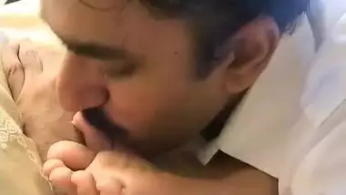 Mustached Indian man worships feet of girl in blue dress in XXX video
