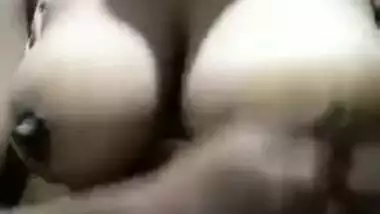 Mom with big knockers touches them and pinches nipples in sex video